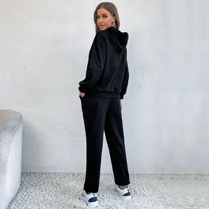 Women's two-piece black tracksuit with a drawstring hoodie and matching lounge pants