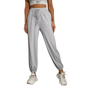 Women's light grey high-waist joggers with drawstring and elastic cuffs for activewear