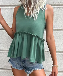 Detail of V-neck sleeveless peplum top in sage green showing fabric texture and layers