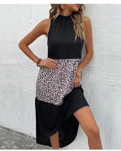 Detail of summer halter sleeveless dress with black and leopard print patchwork fabric
