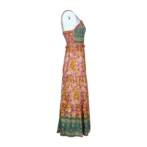 Detail of bohemian floral maxi dress featuring smocked bodice and tiered hemline