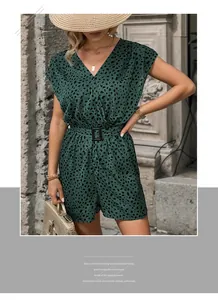 Detailed view of deep green floral jumpsuit with V-neck and stylish waist belt buckle