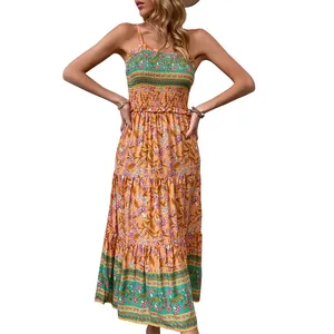 Bohemian tropical print maxi dress with smocked bodice and adjustable spaghetti straps