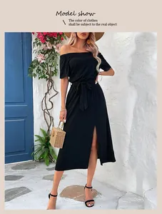 Detail of black off-shoulder midi dress featuring a waist tie and side split design