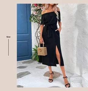 Detail view of the black off-the-shoulder midi dress featuring a tie-waist and side slit