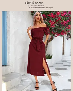 Detail of off-shoulder burgundy midi dress featuring a waist tie and high side slit