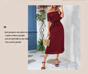 Detail of burgundy off-shoulder slit dress with matching waist belt and elegant texture