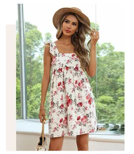 Detail of summer dress featuring red floral print, square neck and ruffle shoulder straps