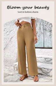 Detail of high waisted trousers with button decor and textured fabric in khaki