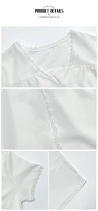 Close-up of white blouse featuring delicate lace trim on V-neckline and sleeve cuffs