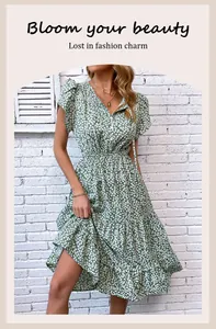 Detail of green floral dress featuring V-neckline with ties and ruffled butterfly sleeves