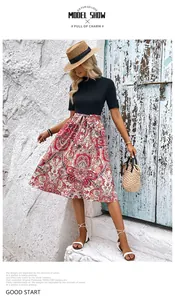 Détail d'une robe patchwork à imprimé bohème avec corsage noir ajusté et ceinture assortie