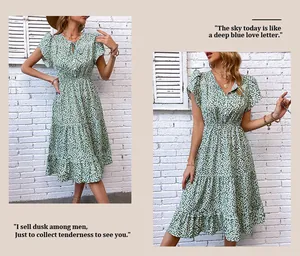 Detail of green floral dress featuring a V-neckline with lace trim and ruffle sleeves