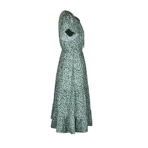 Detail view of dark green floral tiered dress with puff sleeves and ruffled hem layers