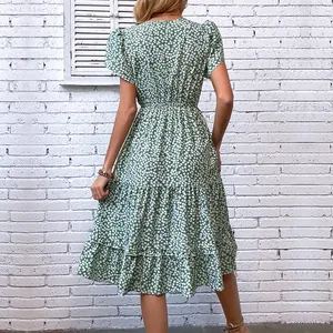 Short sleeve green floral maxi dress with tiered skirt and elastic waist, back view