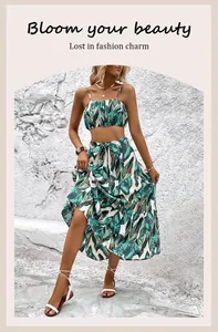 Detail of two-piece summer set featuring tropical leaf print and waist tie design