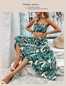 Detail shot of a tropical print two-piece set with crop top and high-waisted maxi skirt
