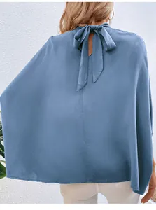 Detail of elegant blue satin sleeveless blouse featuring a back tie bow design