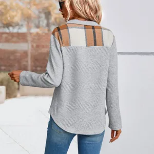 Women's casual long sleeve pullover with grey textured fabric and plaid patchwork back detail