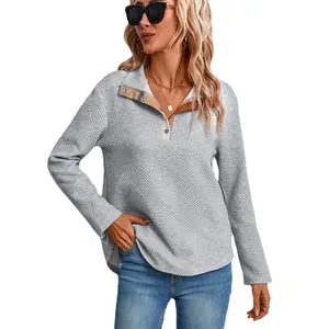 Women's light grey long sleeve Henley sweater with plaid patchwork collar detail