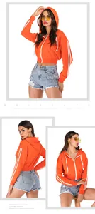 Detailed views of cropped orange zip-up hoodie with white sleeve stripes and denim shorts
