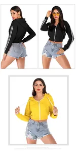 Detail of cropped hooded sweatshirt with zipper and athletic double stripes on sleeves