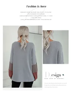 Detail view of waffle texture fabric and color-block cuffs on gray long-sleeve knit top