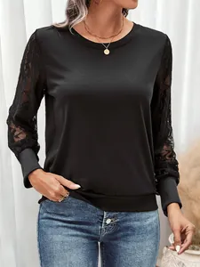 Detailed view of the elegant black mesh lace sleeves with floral crochet textures