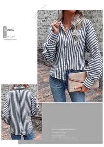 Detailed view of grey and white striped shirt with classic collar and button-up front