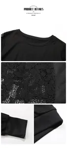 Close-up of black sweatshirt with intricate floral lace stitching on sleeves and ribbed collar