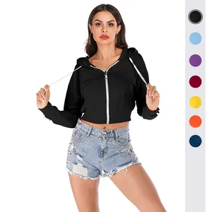 Women's black cropped zip-up hoodie with white zipper and circular puller detail