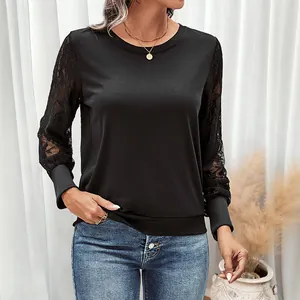 Chic black long-sleeved top for women featuring intricate lace splicing and ribbed cuffs
