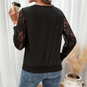 Chic black long sleeve top for women featuring elegant lace patchwork sleeves and crew neck