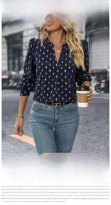 Detail of dark blue V-neck blouse with gold geometric diamond print and silky texture