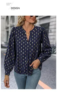 Detailed shot of dark blue shirt with golden diamond print and stylish puff sleeves