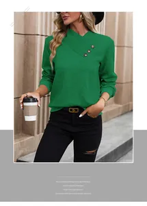 Detail of green long sleeve top featuring asymmetrical V-neck and diamond texture