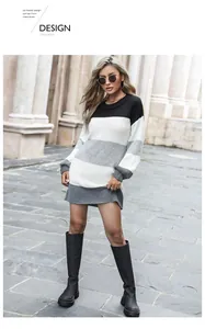 Détail de la maille d'une robe pull à manches longues avec un design tricolore moderne