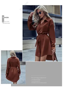 Détail d'une robe chemise de style français avec ceinture et ourlet asymétrique marron