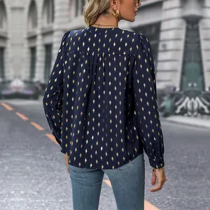 Navy blue long sleeve blouse with gold diamond pattern and pleated back detail