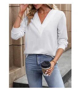 Detail of white V-neck pullover sweater with ribbed cuffs and stylish layered design