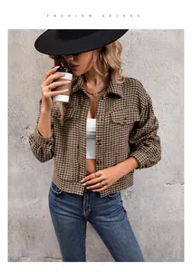 Street style view of plaid cropped jacket with brown buttons and symmetric chest pockets