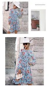 Close-up of light blue floral dress showing pleated texture and pink rose patterns