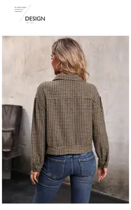 Back view of a brown houndstooth cropped jacket with lapels and long sleeves