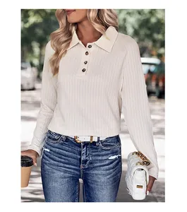 Detailed view of women's ribbed knit polo shirt featuring vertical texture and buttons