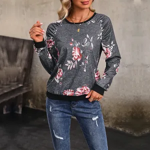 Damen Herbst-Sweatshirt mit rosa Blumenmuster und schwarzen gerippten Bündchen