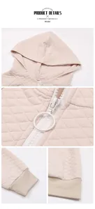 Detail of waffle quilted hoodie featuring round ring zipper and ribbed cuffs for comfort