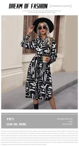 Detail of black and white abstract print shirt dress with belt and side slit detail