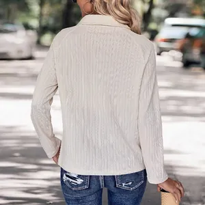 Chic beige ribbed knit long sleeve shirt with polo collar and button detail for women