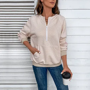 Women's quilted waffle knit hoodie with half-zip collar and kangaroo pocket in light pink