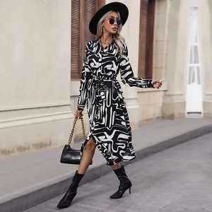 Chic black and white abstract print long sleeve shirt dress with waist tie and buttons